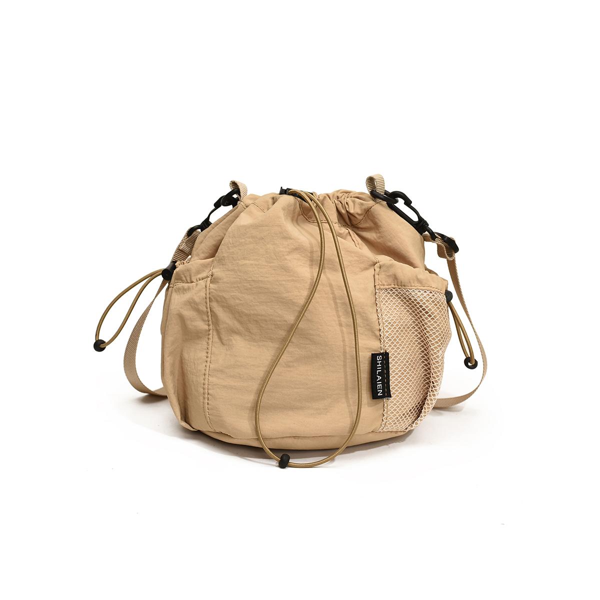 

K-Style Нишевая нейлоновая сумка для женщин 2025 Легкая и универсальная Ins сумка через плечо Сумка-ведро на шнурке Сумка для мобильного телефона хаки