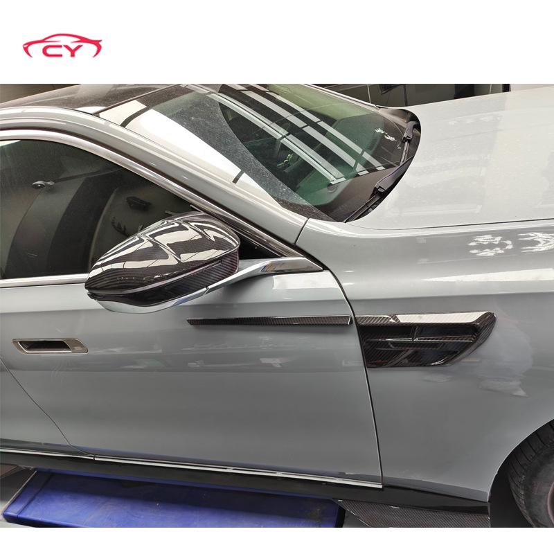 BMW 7 Series G70 Dry Carbon Fiber Body Kit: Front Lip, Side Skirts, Rear Lip Trim in Mansory Style