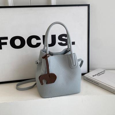 Textuur kleine tas dames herfst nieuw populair veelzijdige schoudertas modieuze dames draagbare emmertas