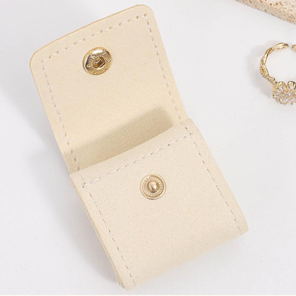 Compact Travel Jewelry Organizer Bag with Secure Button Closure Separate Compartments for Rings Earrings Necklaces