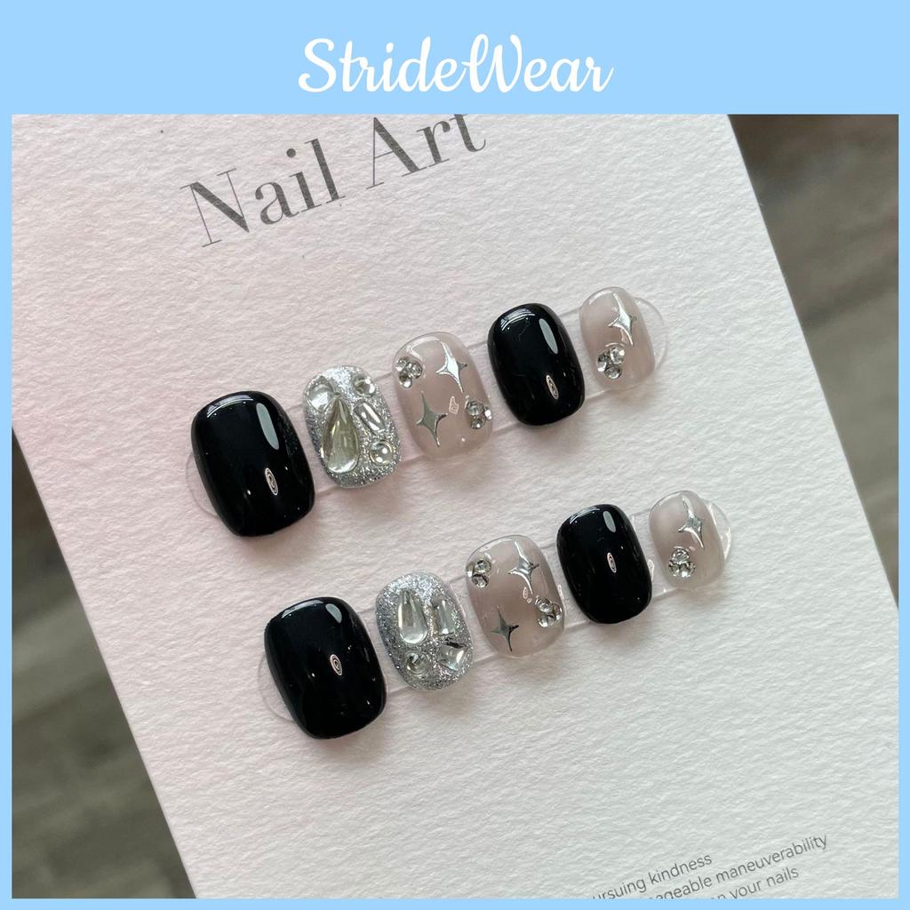 Short Fake Nail Decals With Black Sparkling Water Diamoans And Star Motifs For Cute And Trendy Nail Looks