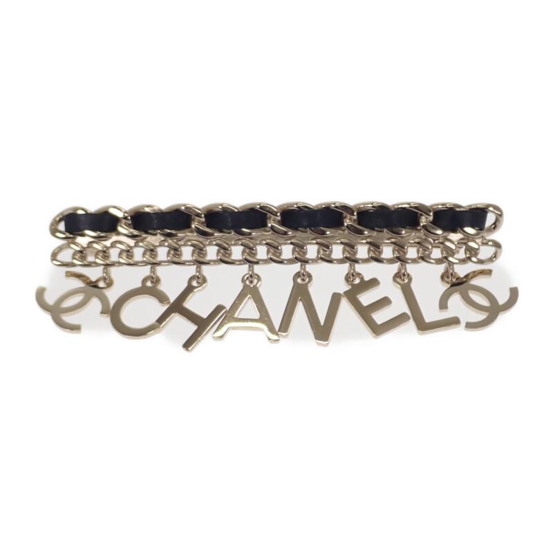 

CHANEL Brooch gold/black metal/leather Women
