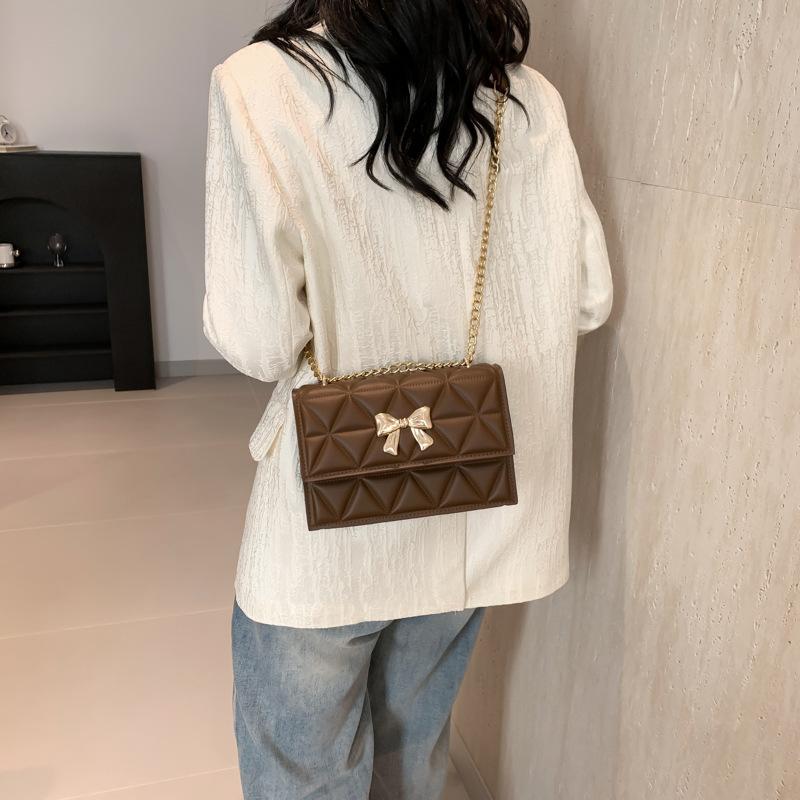 Geantă de mână cu lanț și design de nișă pentru femei, de primăvară, nouă, la modă, cu arc decorativ, cu un singur umăr, cu romb oblic, pătrat