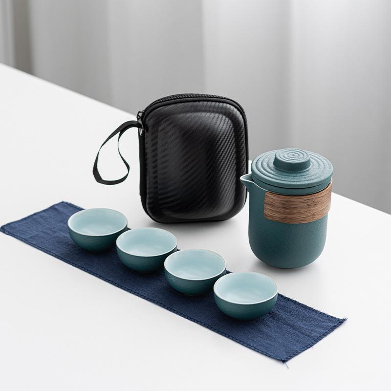

Black pottery travel portable set, one pot, two or four cups, ceramic express cup, kung fu tea set, office business gift.