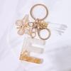Chic White Tassel Letter Keychain with Resin Epoxy Pendant - Stylish Ornament for Bags