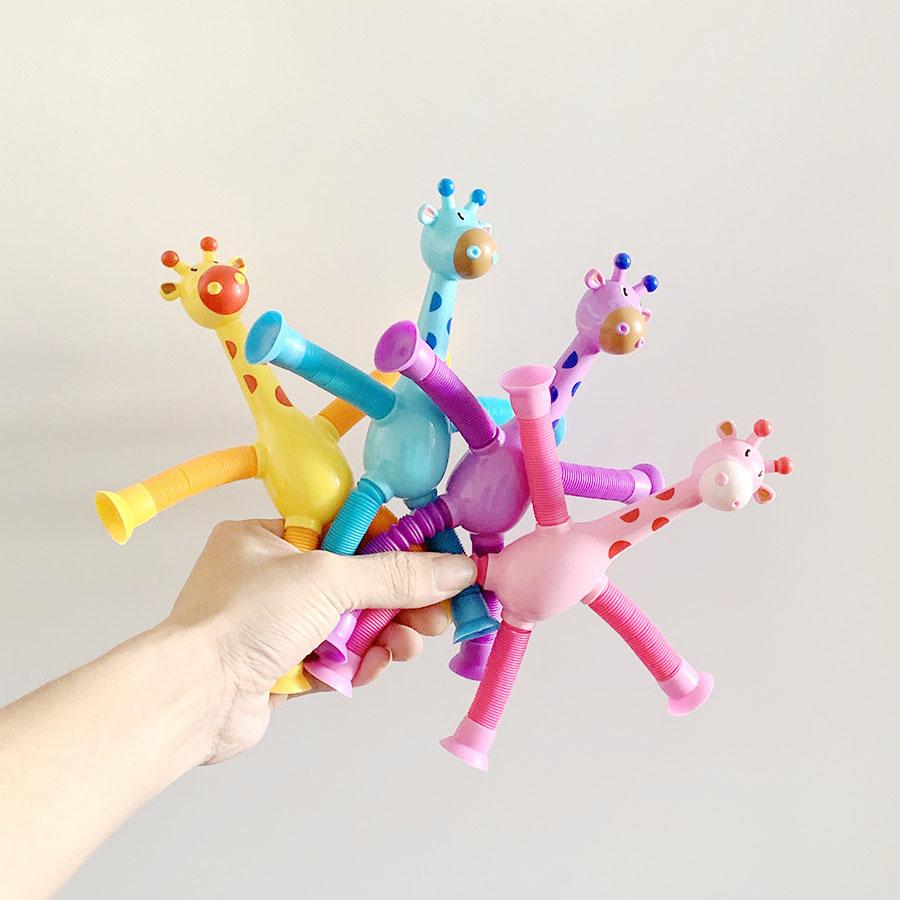Suction cup giraffe robot telescopic toy with versatile light, elongated tube, children's cartoon creative puzzle toy