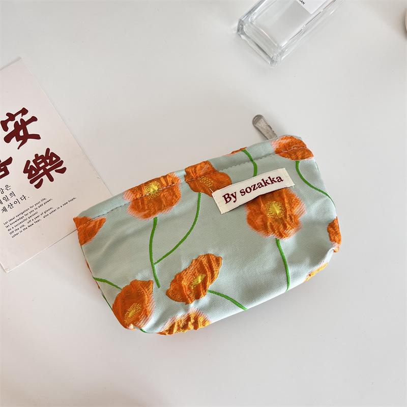 Trendy Ladies Simple And Portable Floral Embossed Cosmetic Bag For Use Everyday