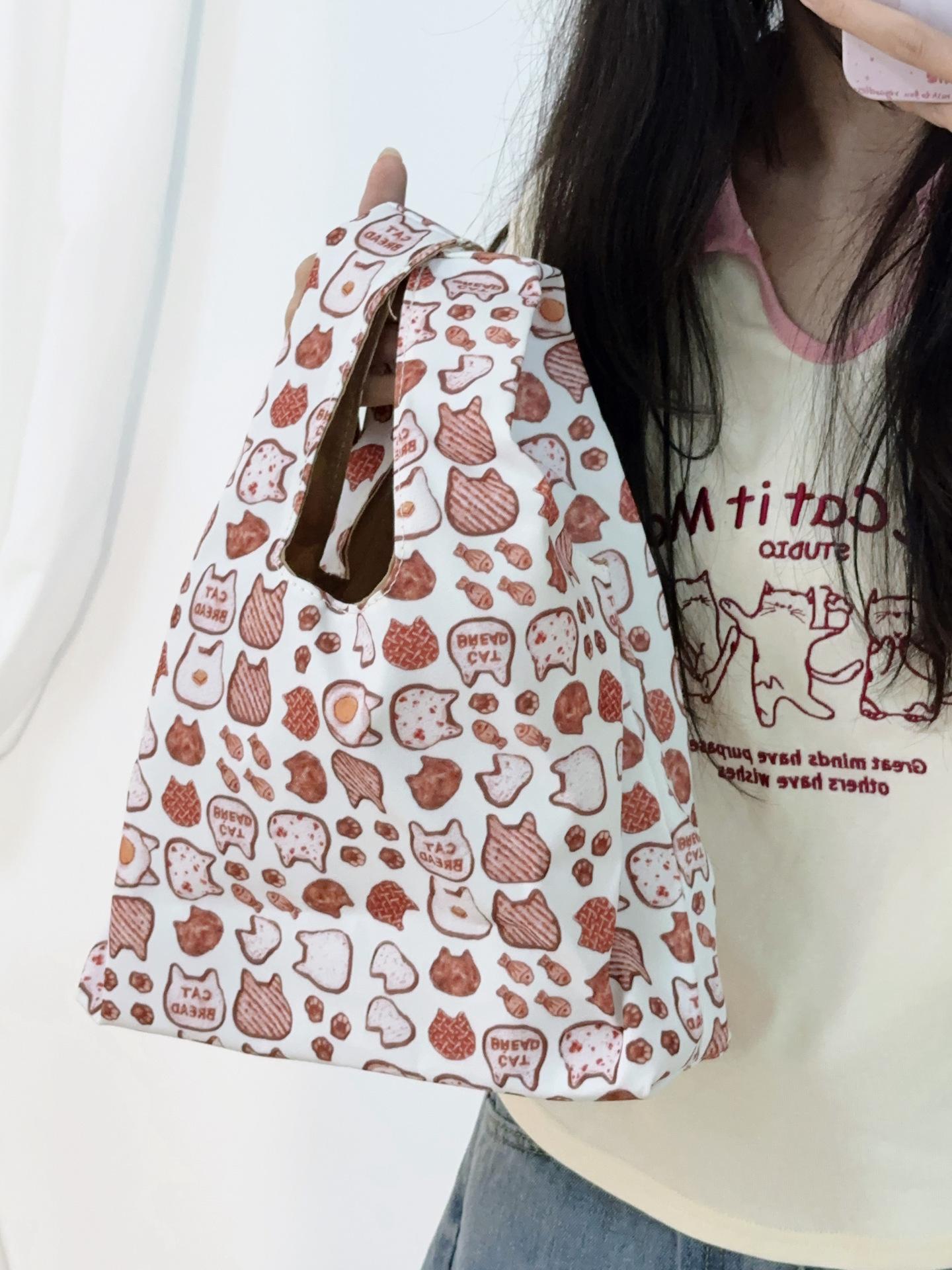 

Japanese cartoon cat bucket bag student handbag 2025 new simple commuter bento bag going out storage bag