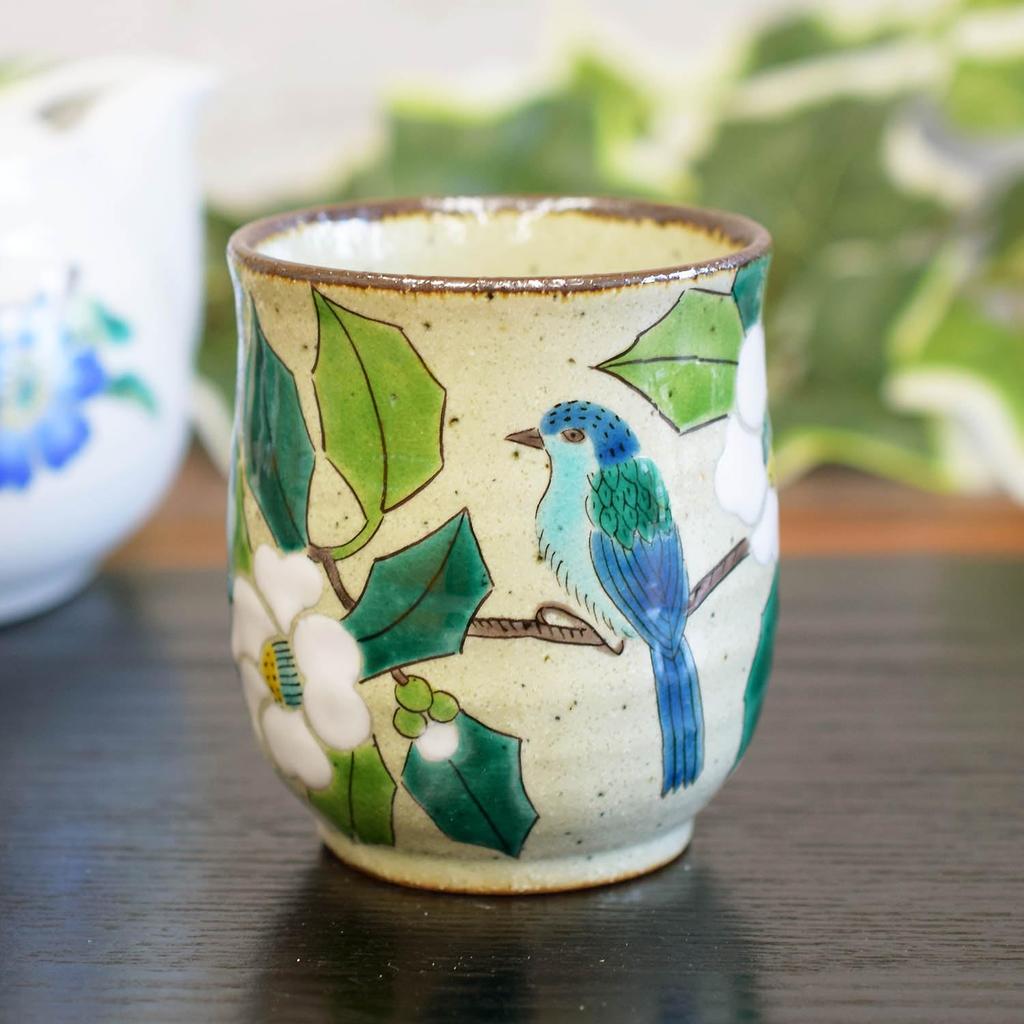 Stylish Kutani Ware Teacup Featuring a White Camellia and Bird Design. Made In Japan. A Brand of Ceramic.