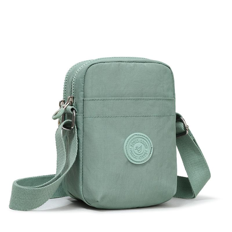 Compact Nylon Crossbody Bag with Double Zipper Closure Adjustable Strap Small Casual Purse for Daily Travel