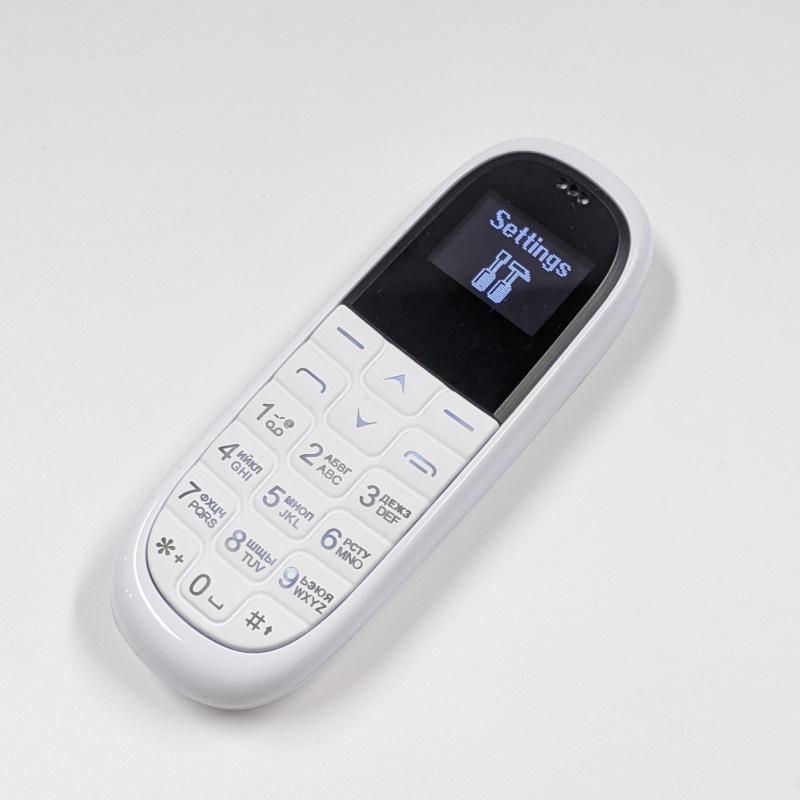 Novo KK1 Super Mini Celular 0.66 polegadas OLED Fone de Ouvido Bluetooth Modificador de Voz Discador Gravação Automática de Chamadas Portátil Barato Desbloqueado Celular