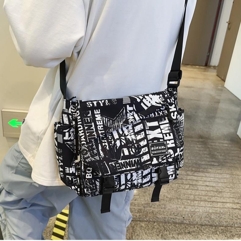 2024 Neue Street Herren- und Damen-Umhängetasche Großes Fassungsvermögen Bedruckte Schultertasche Koreanische Mode Studenten-Rucksack Aufbewahrungstasche