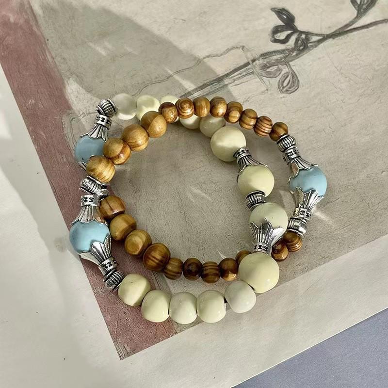 Keramikperlenarmband für Damen, Ethno- und Exotik-Stil, elastisches Seil, chinesisch inspiriertes Design