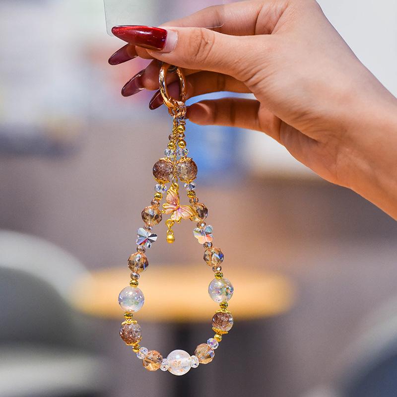 Light luxury crystal mobile phone chain fashion butterfly pendant mobile phone lanyard gold foil handmade beaded short wrist lanyard