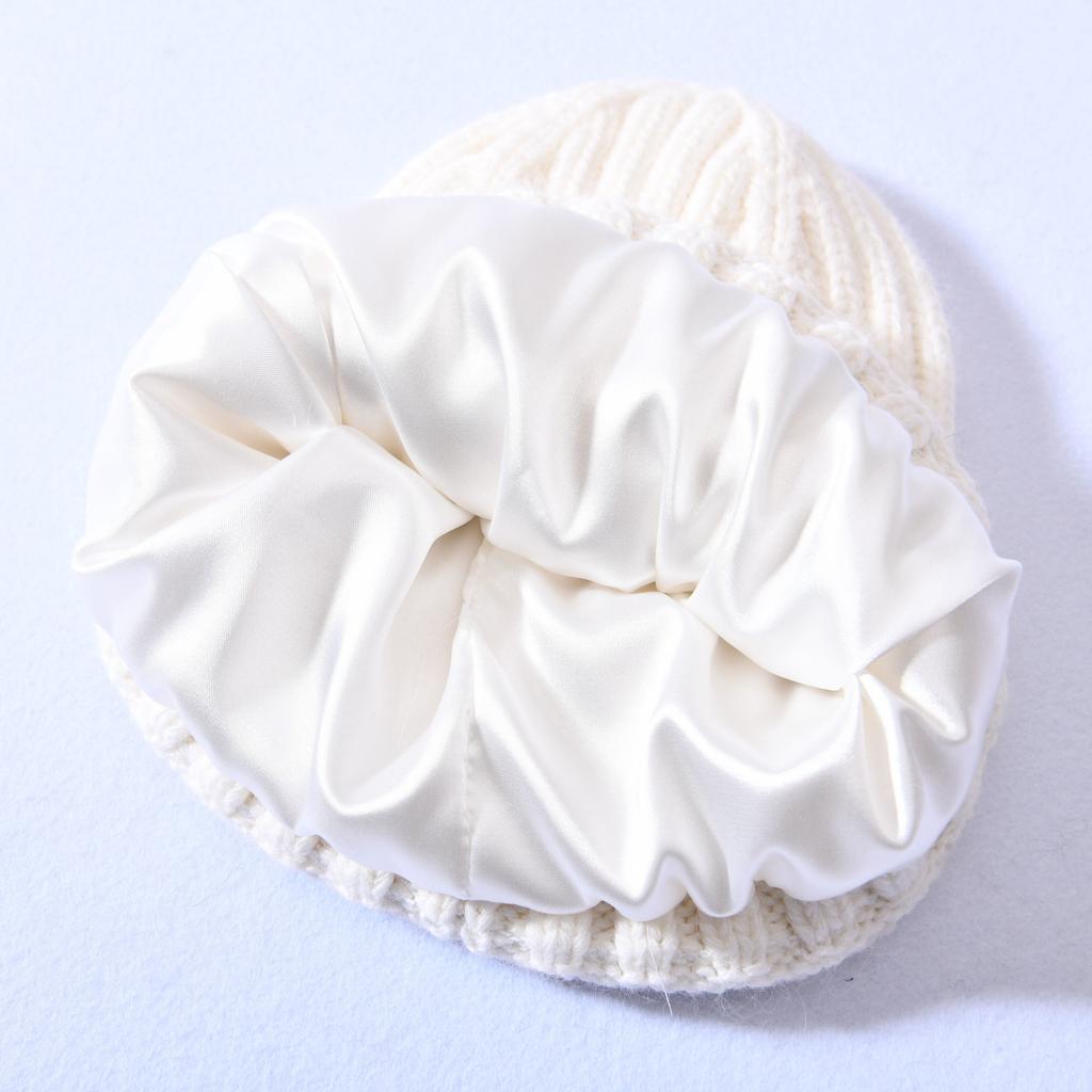 Versatile series big children's rabbit down knitted hat solid color lined outdoor satin lining wool hat warm ear protection
