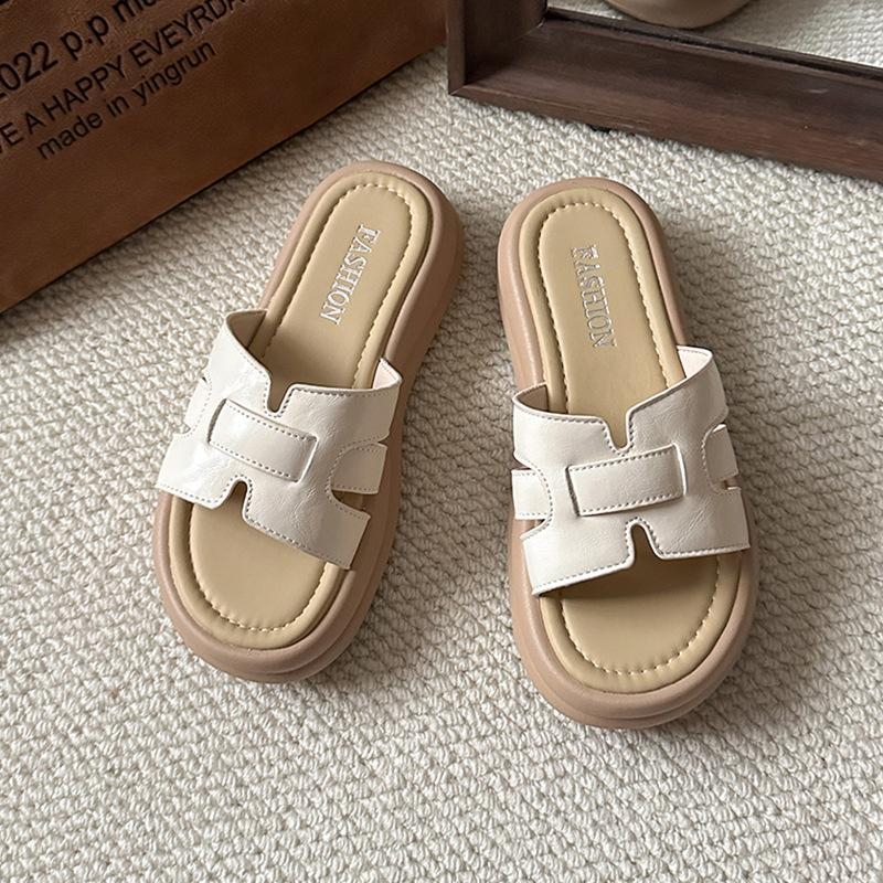 Woven thick-soled one-word slippers for women's summer wear new fashionable and versatile skirts, beach cool slippers