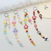 Colorful Beaded Phone Strap with Sheep Horn Accents and Cute Doll Charms