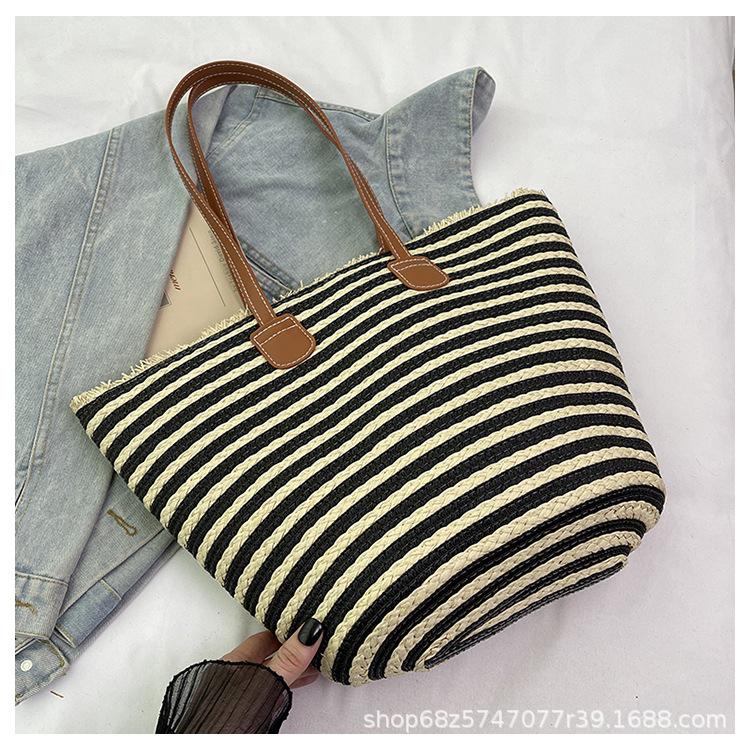 

Commuter large-capacity bag women s 2025 new foreign versatile shoulder bag summer beach vacation straw bag чёрный