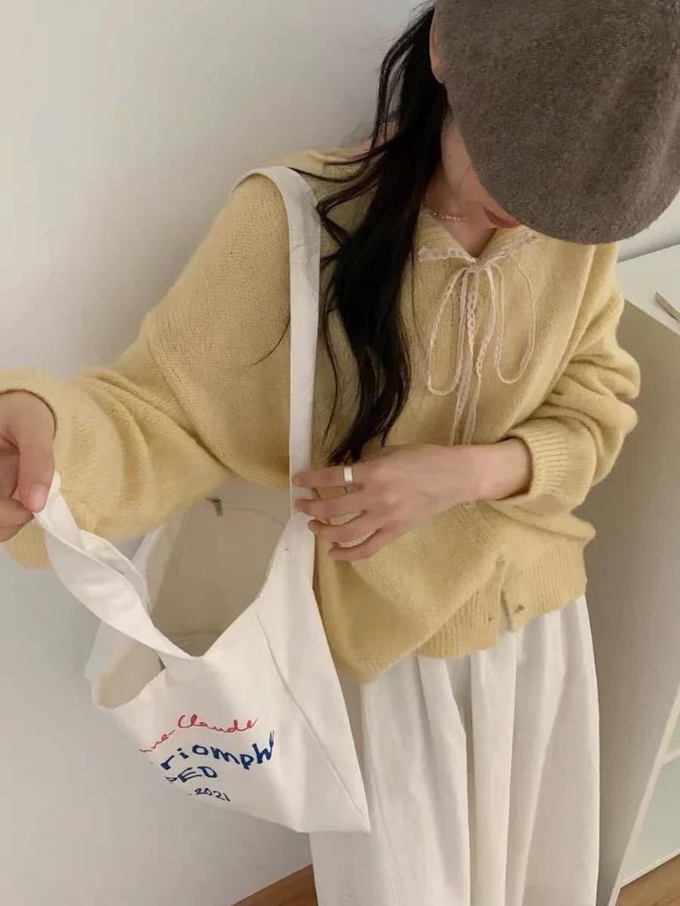 Korean lace-up lace lapel sweater jacket women's 2025 autumn and winter new solid color versatile soft waxy knitted cardigan