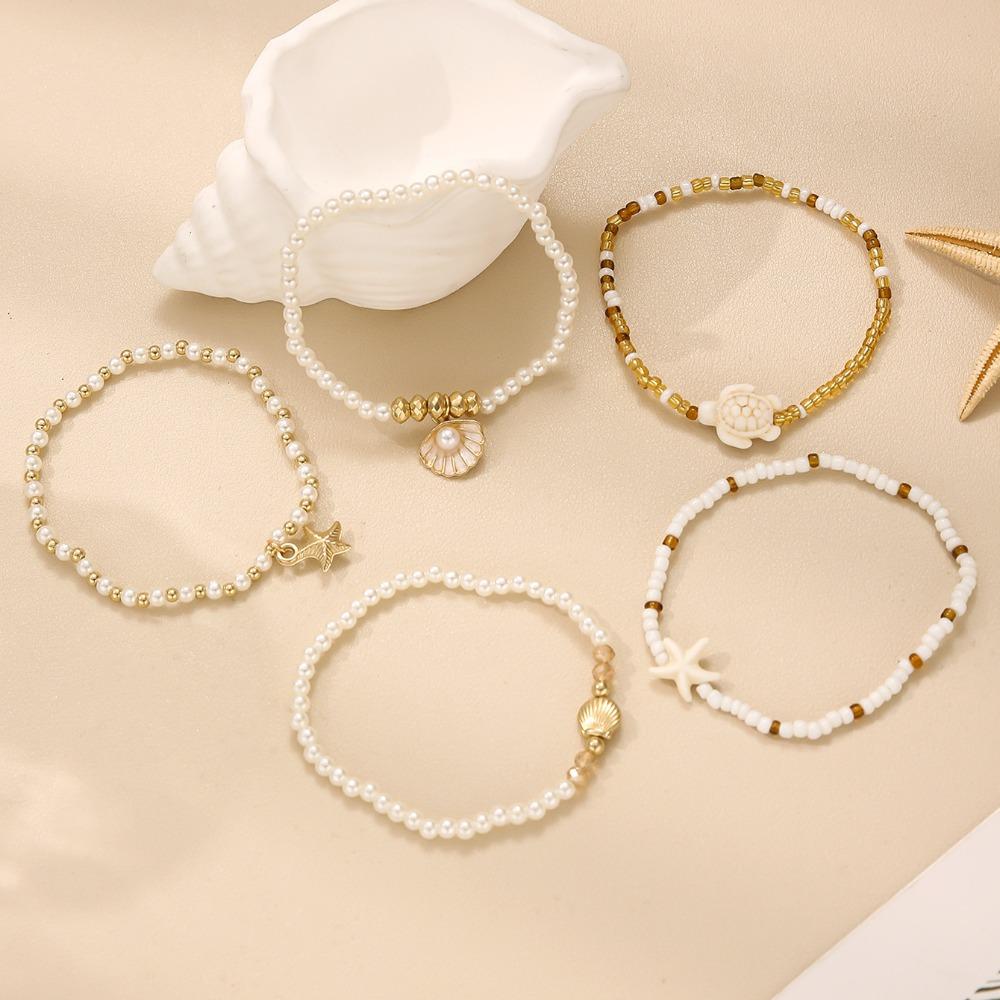 5 Stück Bohemian Meeresmotiv Perlenbesticktes mehrschichtiges Armband-Set für Damen Seestern Schildkrötenpanzer Anhänger Sommer Strandurlaub Schmucksets