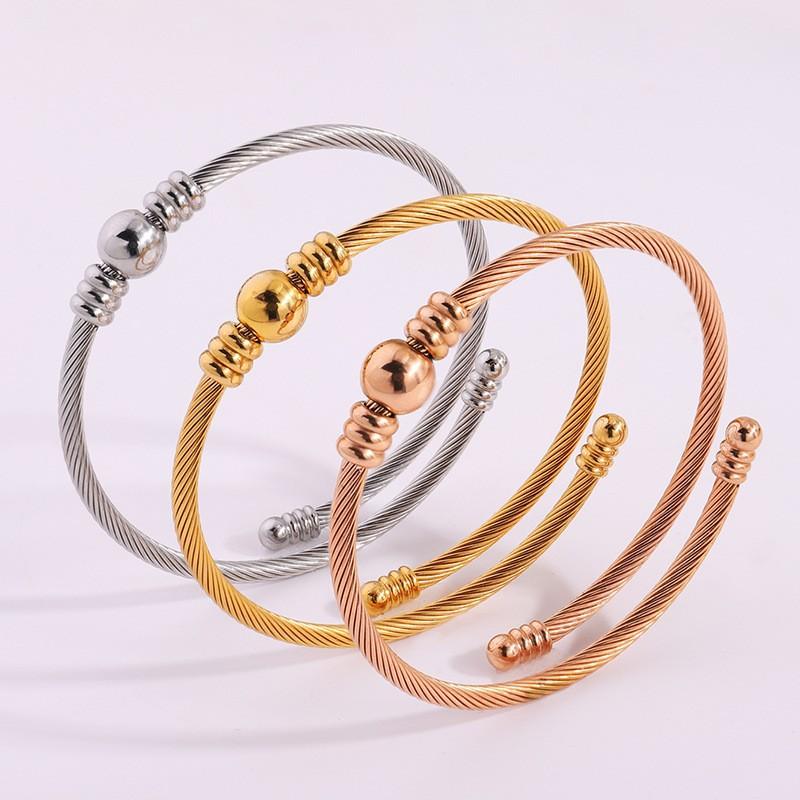 Simple design steel wire opening , fashionable, European and American versatile, send girlfriends round beads, do not fade titanium steel