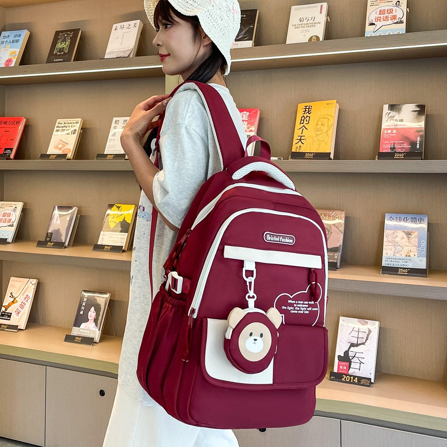 

New junior high school student schoolbag large-capacity burden reduction simple boys and girls backpack multi-functional high-value backpack бордовий