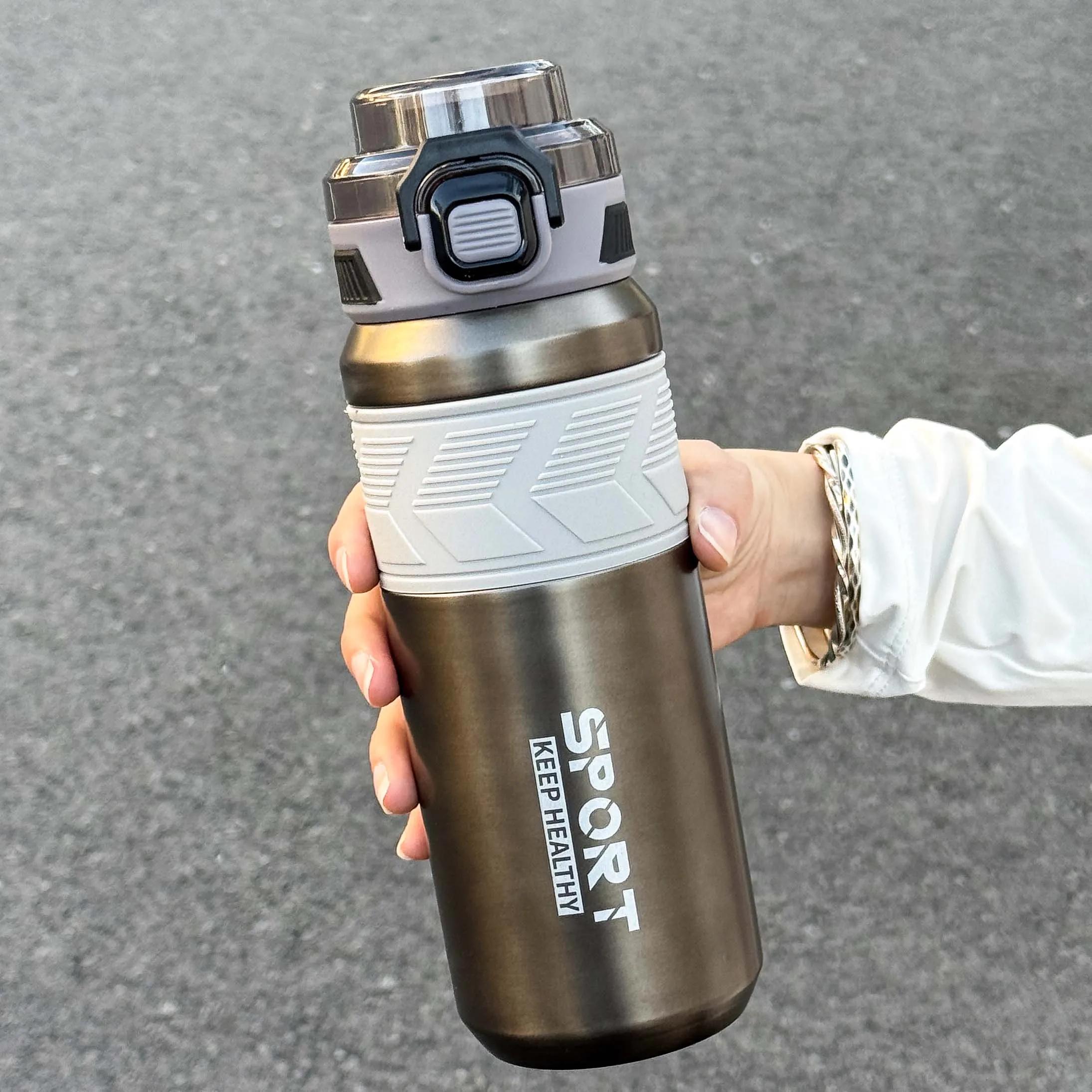 

650ml stainless steel insulated bottle with handle, dual drinking lid design, fashion vacuum thermos for outdoor travel sports 601-700ml сірий колір