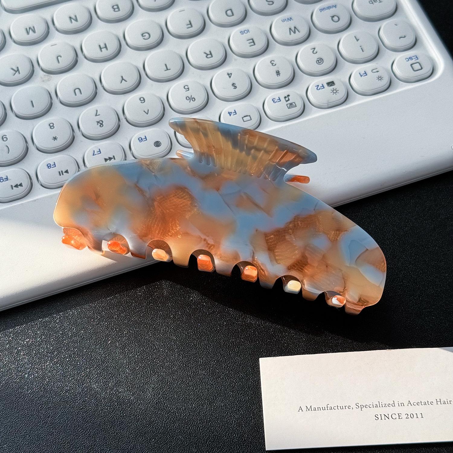 

Large Trendy Hair Claw Clips In Fashionable Geometric Designs Ideal For Everyday Use Orange Blue