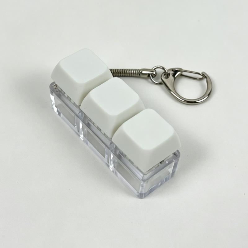 Sleutelhanger voor stressverlichting: Decompressie Kubus met Vier Knoppen & Toetsenbord Hanger