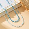 Versatile Sky Blue Bead Necklace: Small & Large Beads for a Fashionable European & American Resort Casual Look.