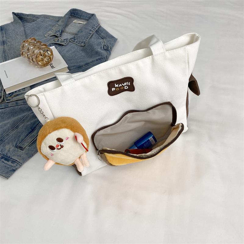 

Large capacity canvas bag, new women s bag, fashionable personality, contrasting color, messenger bag, shoulder bag.