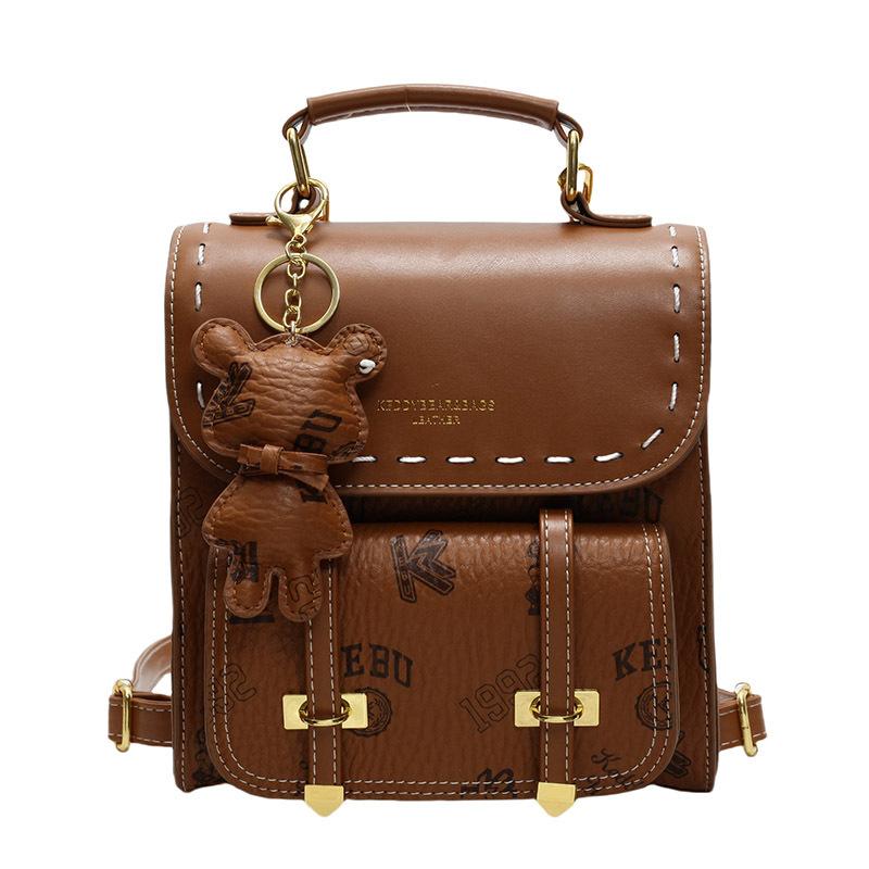 

Retro Printed Backpack for Women, New Summer Fashion Korean Version, Simple and Versatile Crossbody Travel Three-dimensional Small Backpack with pendant коричневий