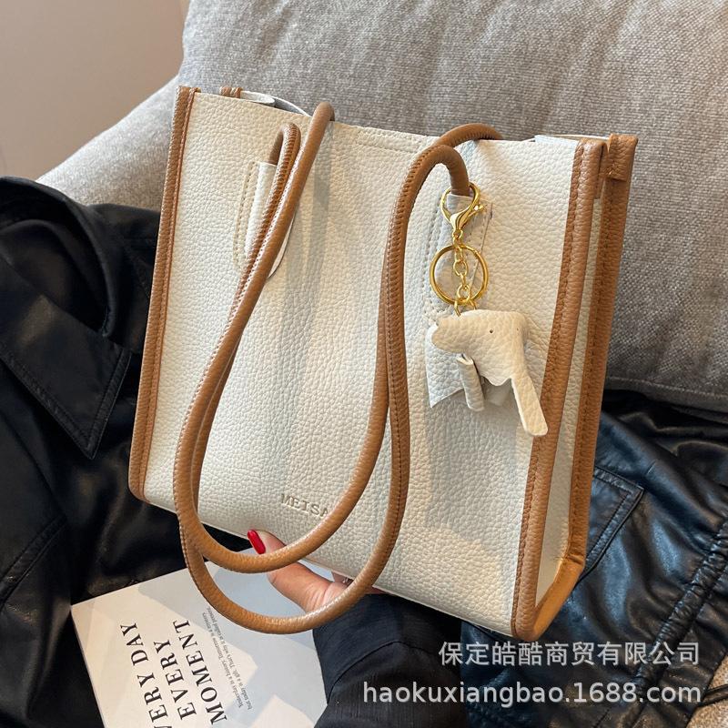 Large capacity bag women's summer 2025 new fashion mother and child bag high sense versatile commuter shoulder armpit tote bag