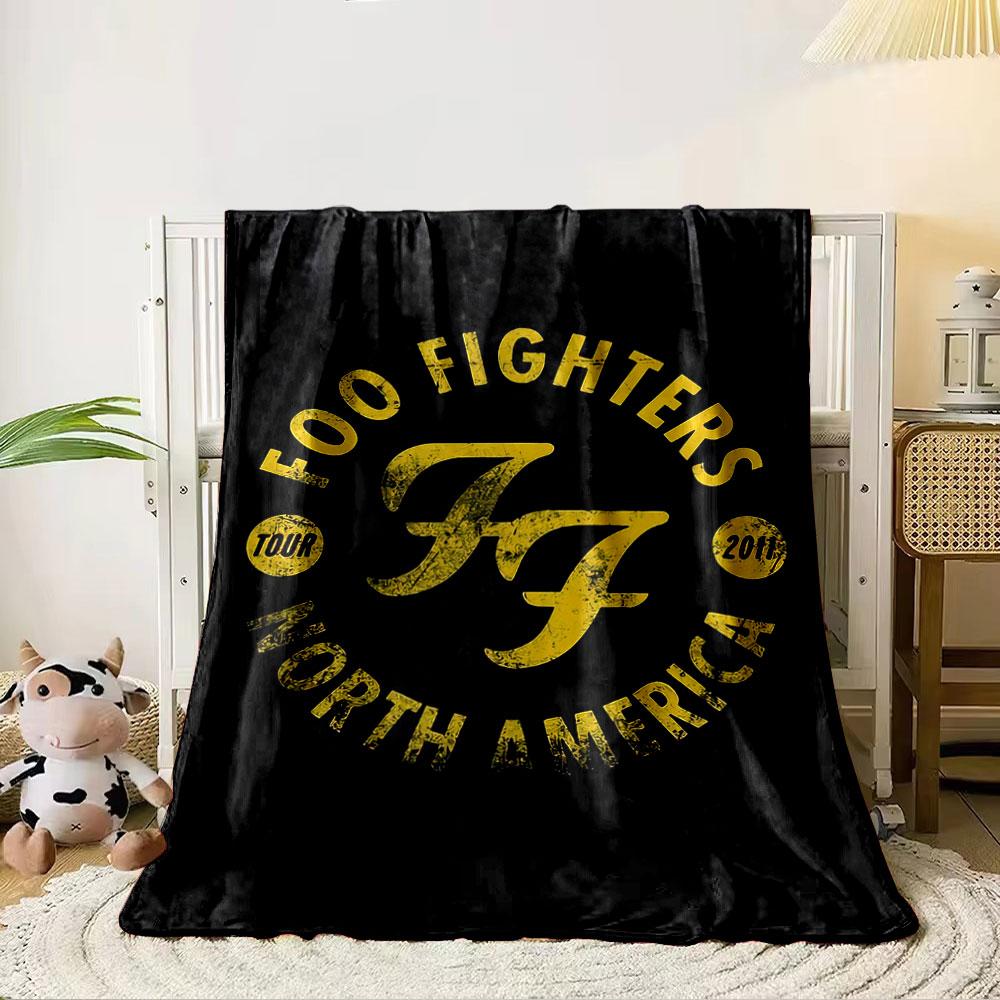 Bold yellow text in a circular arrangement with a stylized FF logo. for all seasons blanket lunch break throw gift 80cm x 120cm