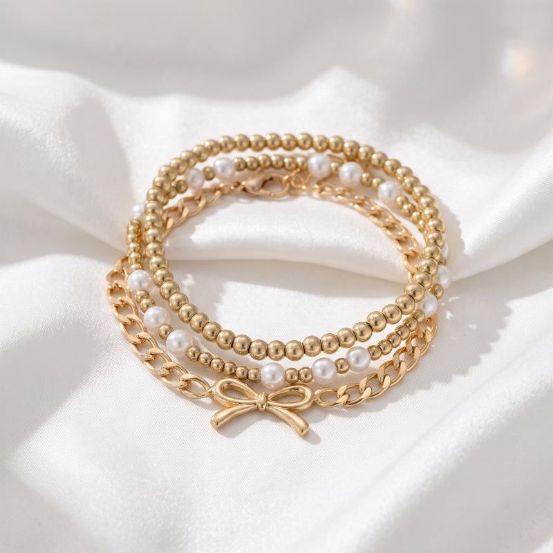 European and American simple bow pendant bracelet, fashionable and versatile imitation pearl star stacked hand jewelry women