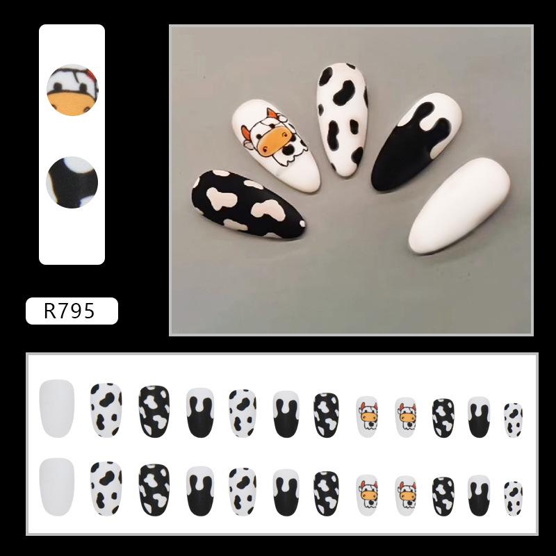 Almond nail round head cute black and white cow flowing heart wearing armor matte texture fake nails wearing armor