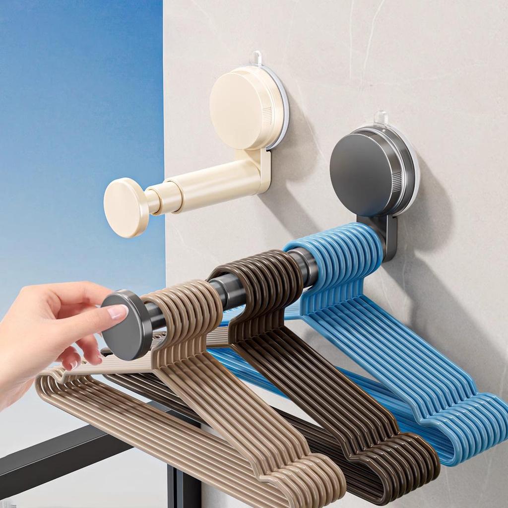 Retractable Wall-Mounted Clothes Rack: Multi-Functional, Seamless, No Punching, with Suction Cup Hangers for Balcony Storage