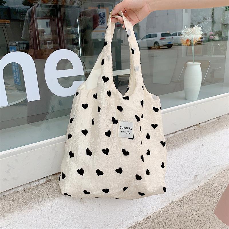  New textured love canvas shoulder vest bag large capacity handbag cosmetic bag student armpit bag