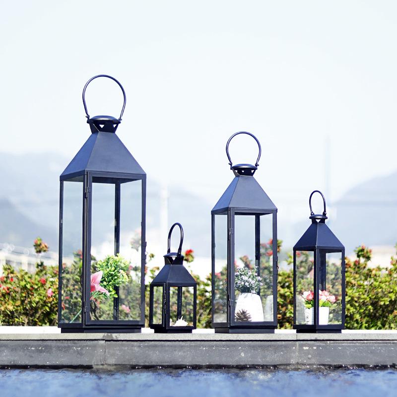 European-Style Wrought Iron Windproof Lanterns - Floor-Standing & Handheld Candlestick Ornaments for Weddings and Courtyard Decoration.