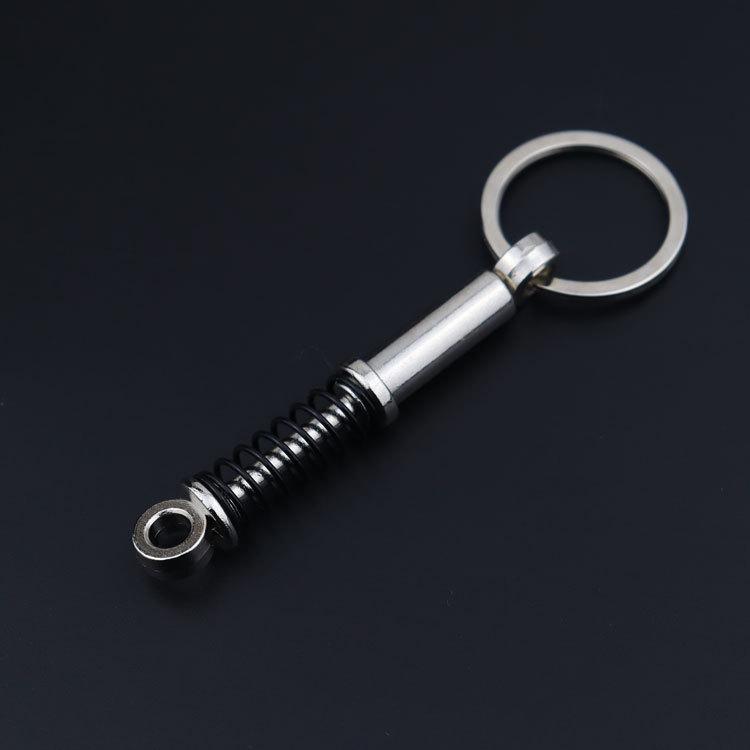 Creative Metal Car Accessories: Shock Absorber Keychain & Suspension Pendant Ring