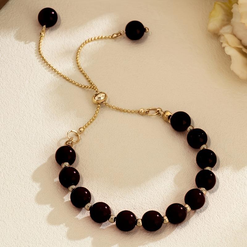 

Natural strong light near round pearl niche high-end bracelet adjustable design temperament чорний