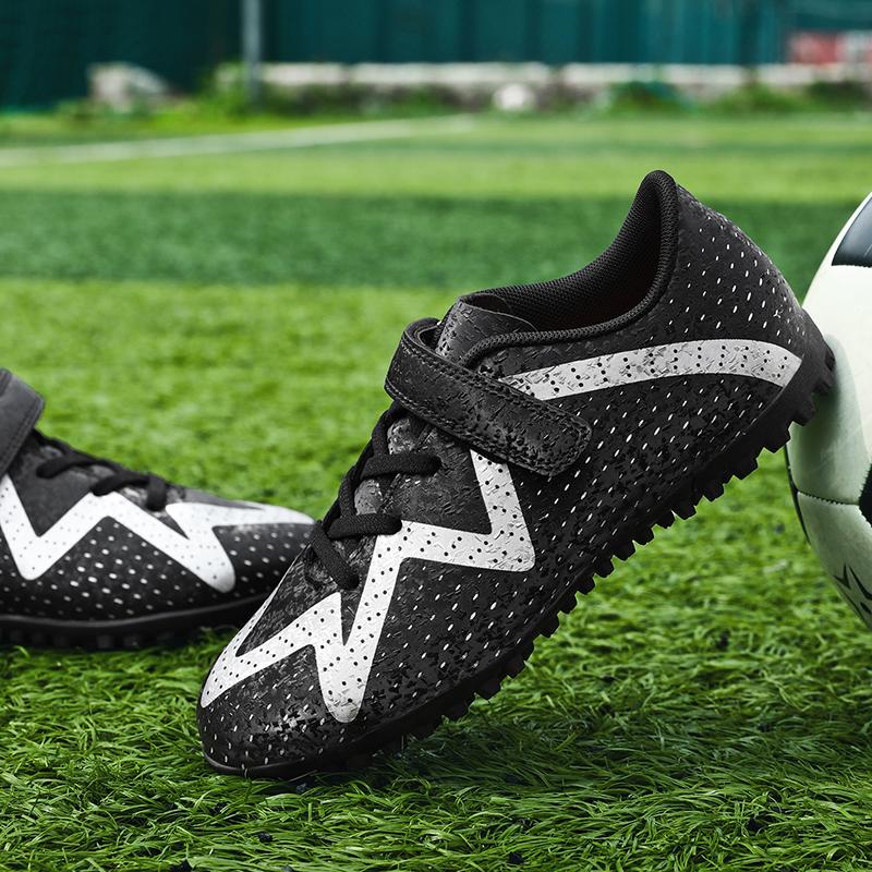 

A pair of student four-season leather Football Sport Activity shoes with studs wear-resistant football shoes sizes 31-39 31