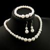Elegante Set di Gioielli in Perle e Diamanti con Collana, Orecchini e Bracciale