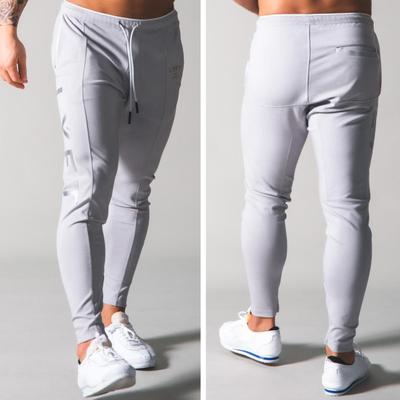 Mittelhohe Elastische Taille Kordelzug Taschen Reißverschluss am Bein Herren Trainingshose Herren Sport Fitnessstudio Schlank Lang Hosen Streetwear