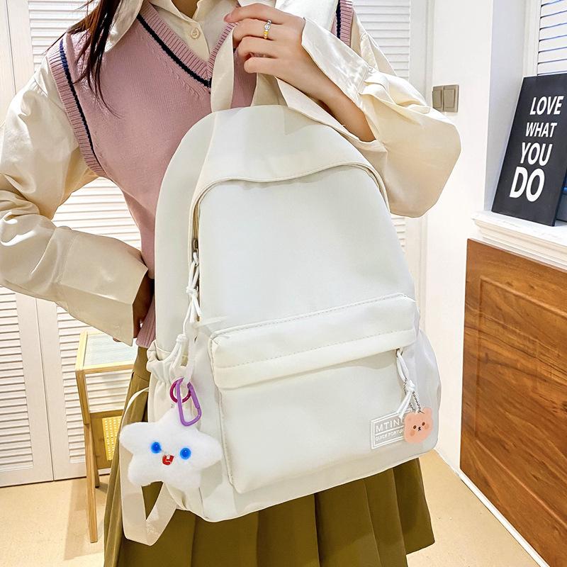 Small fresh girl backpack Japanese solid color schoolbag female Korean version ins versatile large capacity student backpack new