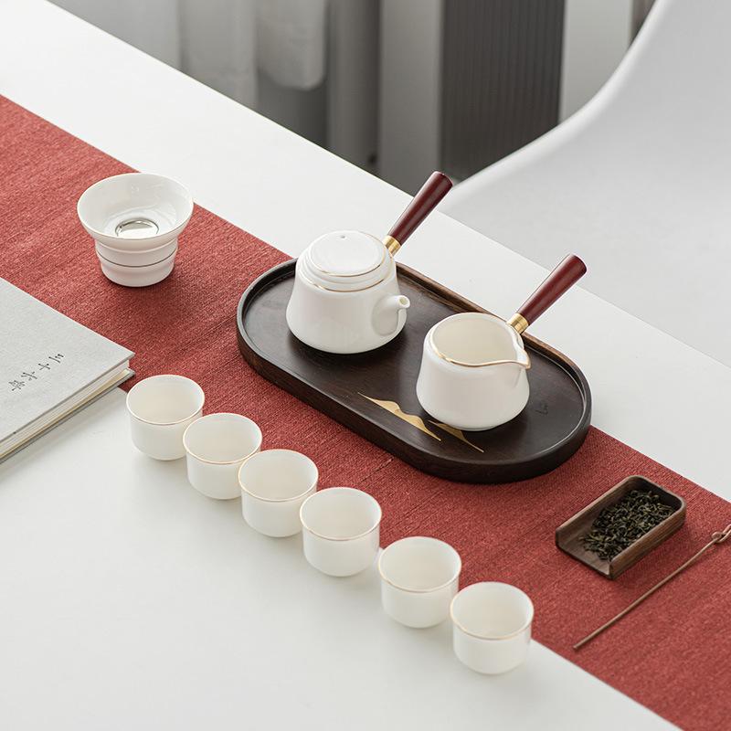 Light luxury suet jade white porcelain kung fu tea set, household gold-painted high-end < unk > pot tea cup gift box hardcover