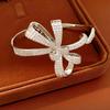 Ningguang Gold-Plated Zirconia Bow Cuff Bracelet: Luxury European-American Fashion Accessory