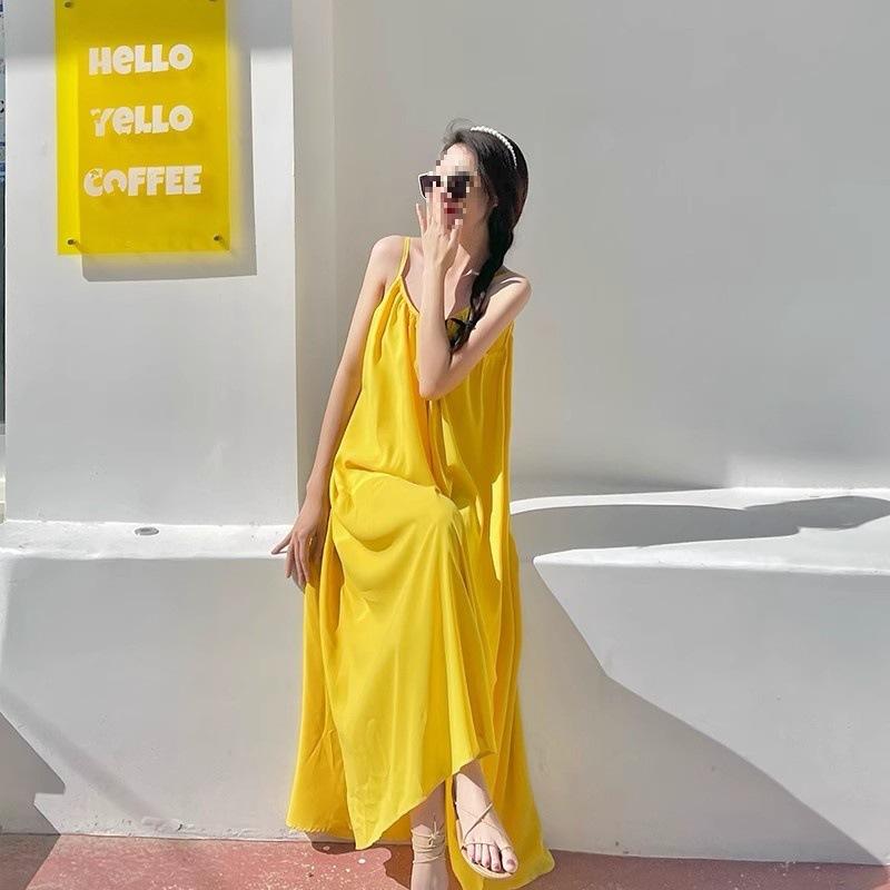 Seaside vacation sexy backless suspender dress women's summer new loose a-word skirt gentle yellow long skirt