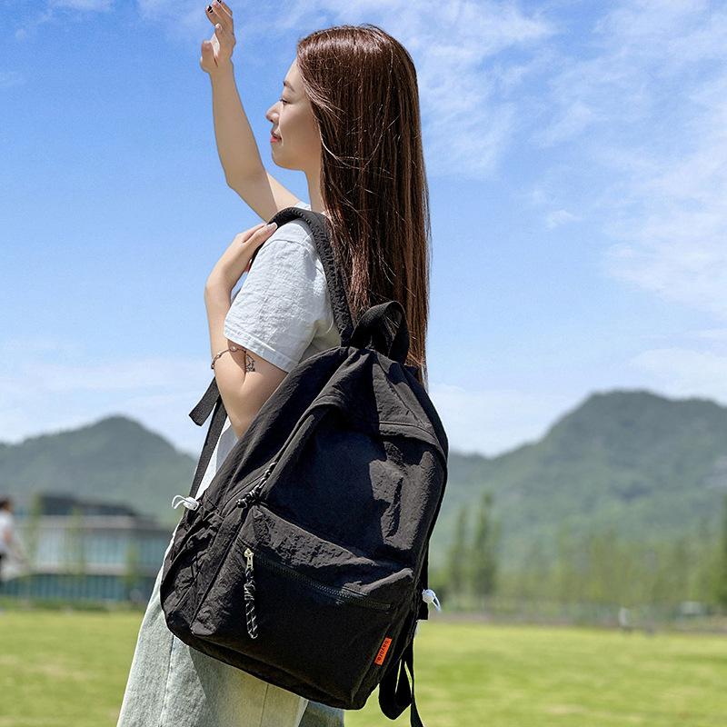 School bag solid color high-end female simple large school bag lightweight high school large capacity couple travel backpack