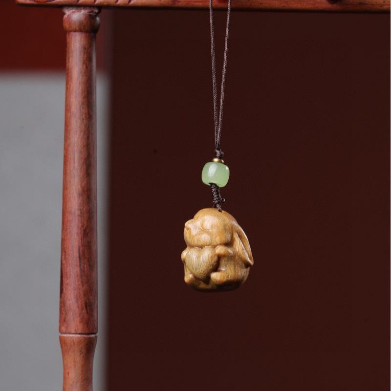 Twelve Zodiac Animal Charms Green Sandalwood Set: Rat, Ox, Tiger, Rabbit, Dragon, Snake, Horse, Sheep, Monkey, Rooster, Dog, Pig.